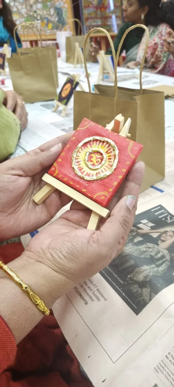 A small Thanjavur-style Om piece made by a participant