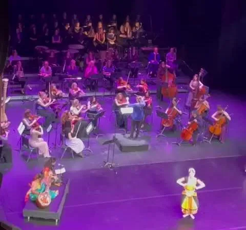 Veena soloist with the Virago Symphonic Orchestra and a dancer on stage at the Bourla Theatre